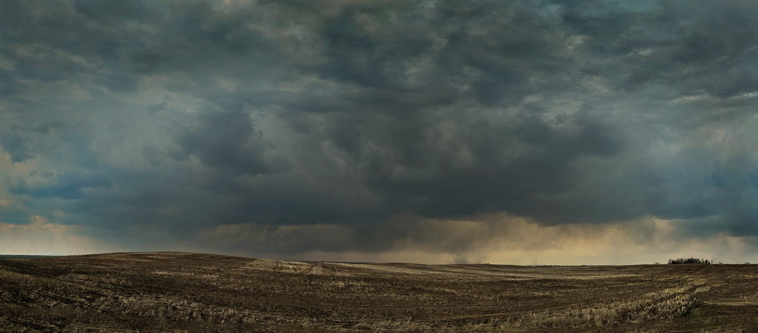 Heading-into-the-next-squall-Hwy-817-West-of-Hanna-Alberta-2024-05-19-scaled